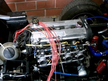 engine bay overview with fusebox in upper left corner